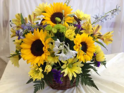 sunflowers with seasonal flowers basket